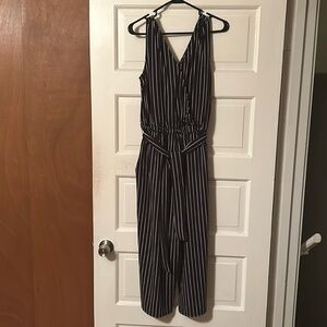 Time and Tru black w/white stripe jump suit with pockets size L (12-14)